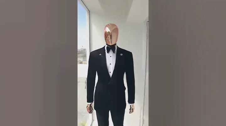 A charcoal black, mushroom pattern jacquard, notch lapel tuxedo suit
