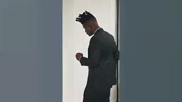 A Charcoal black, knitted, peak lapel suit